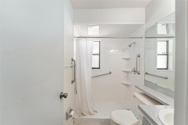 full bath featuring toilet, a shower with curtain, a textured ceiling, and vanity