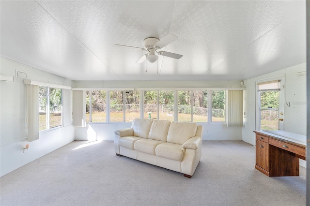 sunroom / solarium with visible vents and a ceiling fan