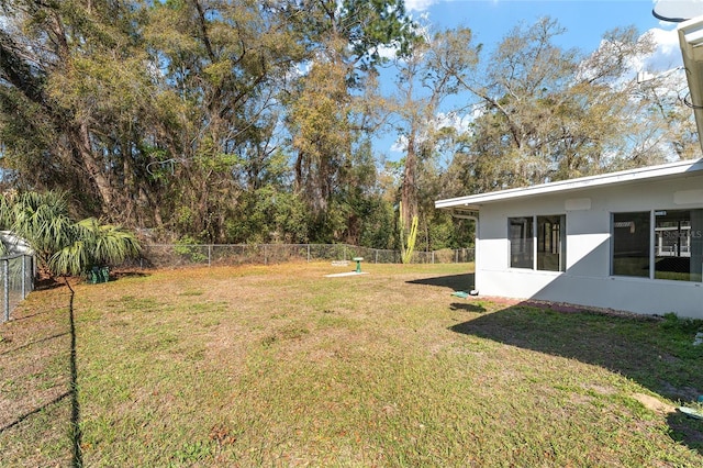 view of yard with a fenced backyard