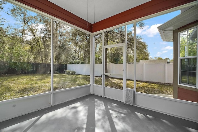 unfurnished sunroom with plenty of natural light