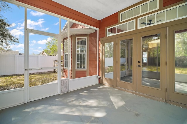 unfurnished sunroom featuring french doors