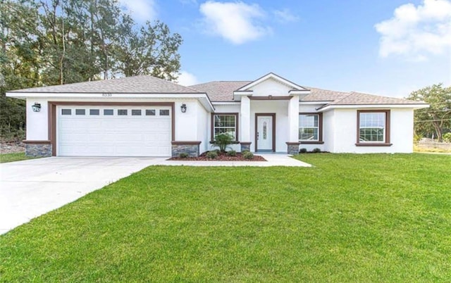 view of front facade with stucco siding, a garage, stone siding, driveway, and a front lawn