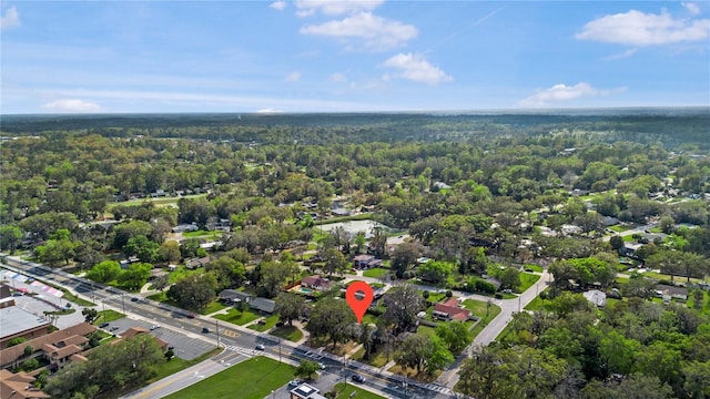 birds eye view of property with a forest view and a residential view