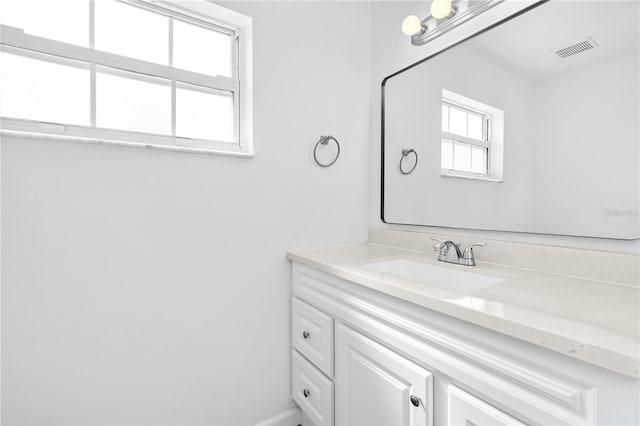 bathroom featuring vanity and visible vents