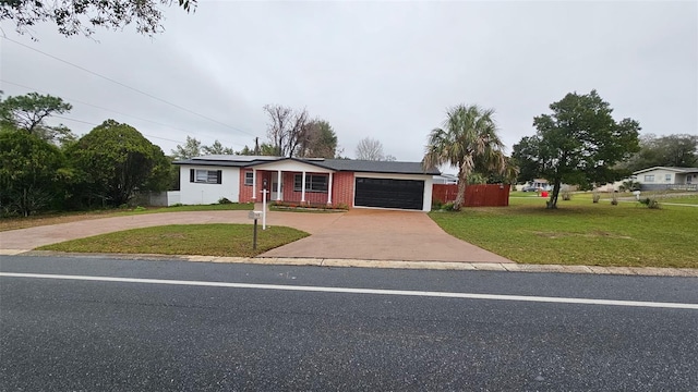 31 Roosevelt Blvd, Beverly Hills, FL 34465 - view of front of house with brick siding, curved driveway, a front lawn, roof mounted solar panels, and a garage