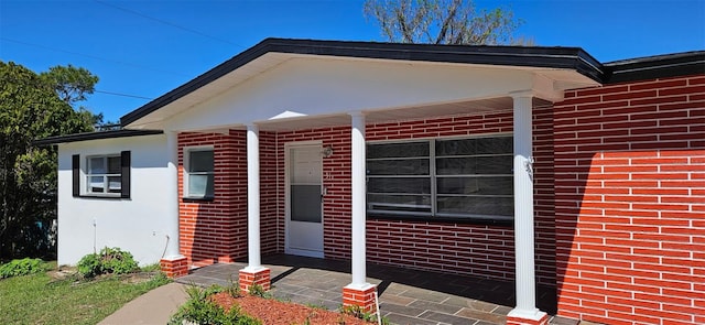 31 Roosevelt Blvd, Beverly Hills, FL 34465 - view of exterior entry with brick siding