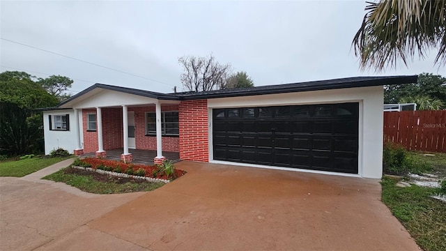 31 Roosevelt Blvd, Beverly Hills, FL 34465 - single story home with stucco siding, driveway, fence, a garage, and brick siding