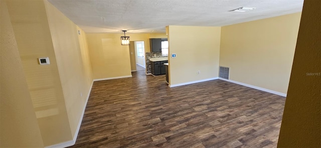 31 Roosevelt Blvd, Beverly Hills, FL 34465 - empty room with visible vents, baseboards, and dark wood-style flooring