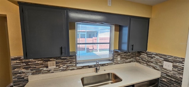 31 Roosevelt Blvd, Beverly Hills, FL 34465 - kitchen with a sink, backsplash, light countertops, gray cabinets, and stainless steel dishwasher