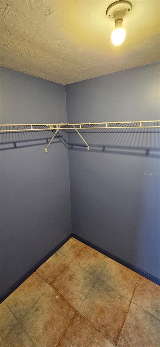 31 Roosevelt Blvd, Beverly Hills, FL 34465 - spacious closet featuring tile patterned flooring