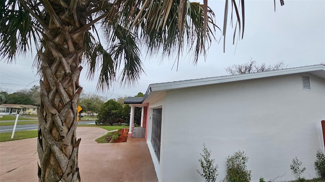 31 Roosevelt Blvd, Beverly Hills, FL 34465 - view of property exterior featuring stucco siding and concrete driveway