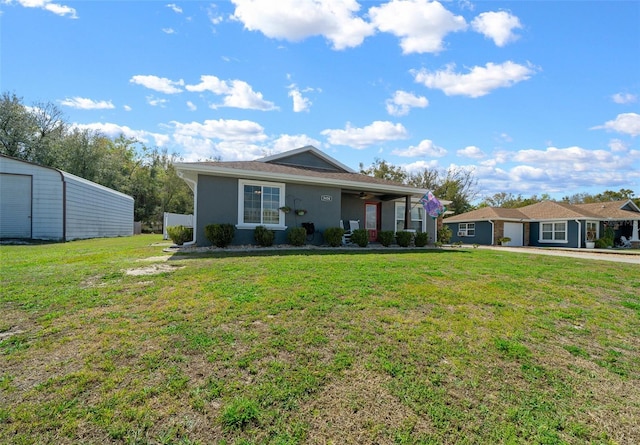 view of front facade featuring a front lawn and stucco siding