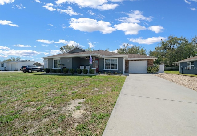 ranch-style home featuring a garage, fence, a ceiling fan, driveway, and a front yard