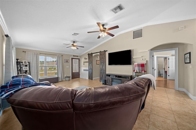 living room featuring crown molding, arched walkways, visible vents, and vaulted ceiling