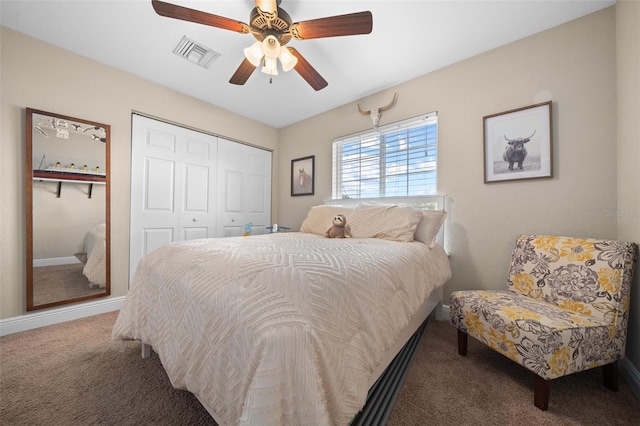 bedroom with baseboards, visible vents, a ceiling fan, carpet flooring, and a closet