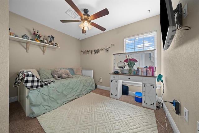 bedroom with a ceiling fan, carpet, visible vents, and baseboards