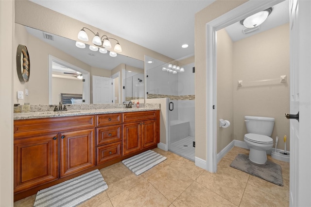 bathroom with double vanity, visible vents, tile patterned floors, a shower stall, and a sink