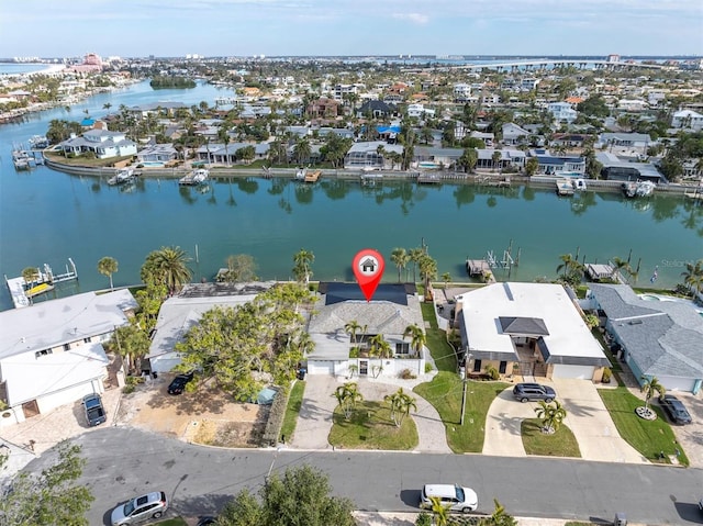 birds eye view of property with a residential view and a water view