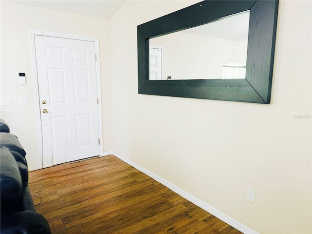 interior space featuring hardwood / wood-style flooring and baseboards