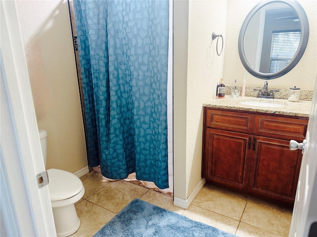 full bath featuring baseboards, toilet, curtained shower, tile patterned flooring, and vanity