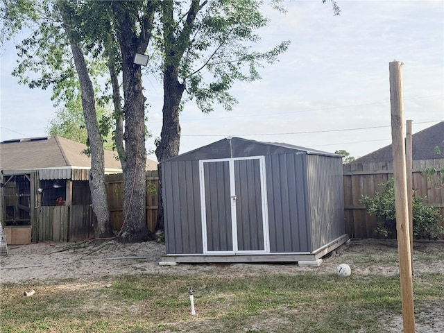 view of shed with a fenced backyard