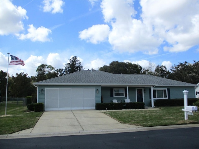 single story home featuring concrete driveway, a front lawn, roof with shingles, and an attached garage