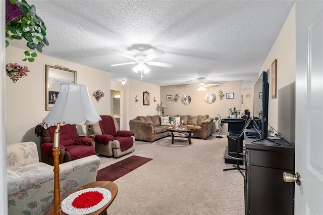 living room with light colored carpet, ceiling fan, and a textured ceiling