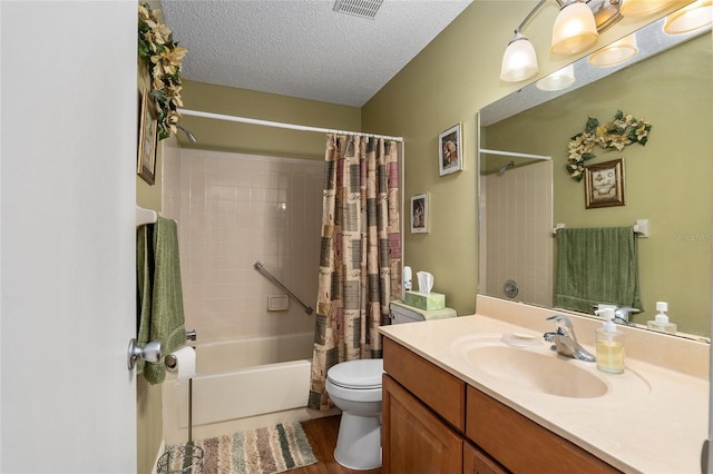 bathroom with a textured ceiling, toilet, visible vents, vanity, and shower / bathtub combination with curtain