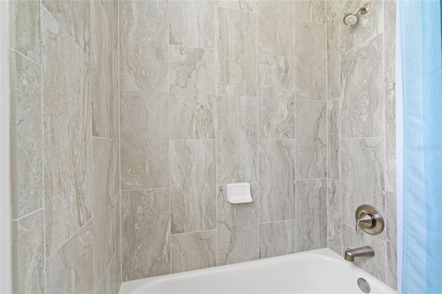 bathroom featuring washtub / shower combination