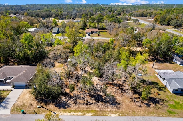 bird's eye view featuring a view of trees