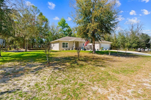 exterior space with a garage and a front yard