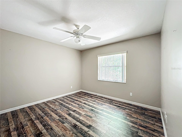 spare room featuring ceiling fan, a textured ceiling, wood finished floors, and baseboards