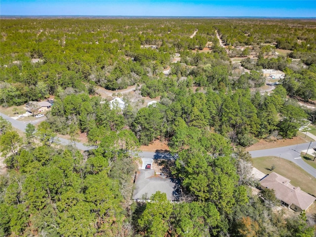 aerial view with a wooded view