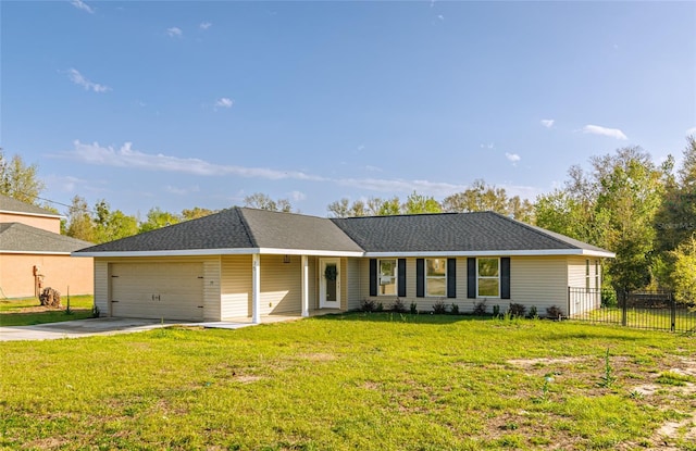 ranch-style home featuring a shingled roof, an attached garage, a front yard, fence, and driveway