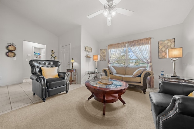 living area featuring vaulted ceiling, ceiling fan, light tile patterned flooring, and baseboards