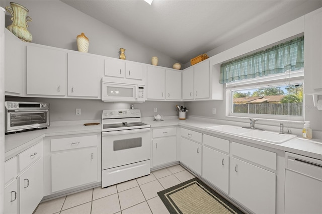 kitchen featuring light tile patterned floors, light countertops, vaulted ceiling, a sink, and white appliances