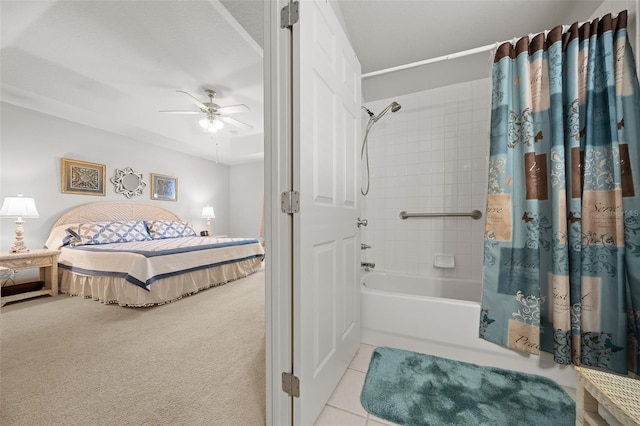 bathroom with a ceiling fan, tile patterned flooring, shower / bathtub combination with curtain, and ensuite bath