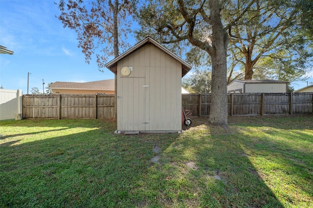 view of shed featuring a fenced backyard