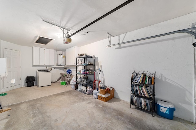 garage with water heater, washer / dryer, and a garage door opener