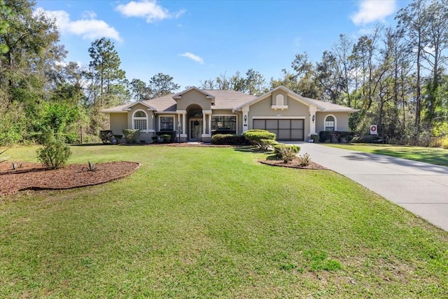 ranch-style house featuring driveway, stucco siding, a garage, and a front yard