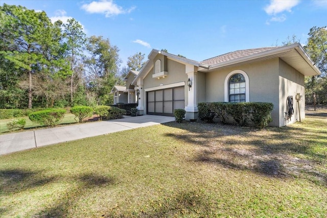 view of front of property featuring a front yard, concrete driveway, an attached garage, and stucco siding