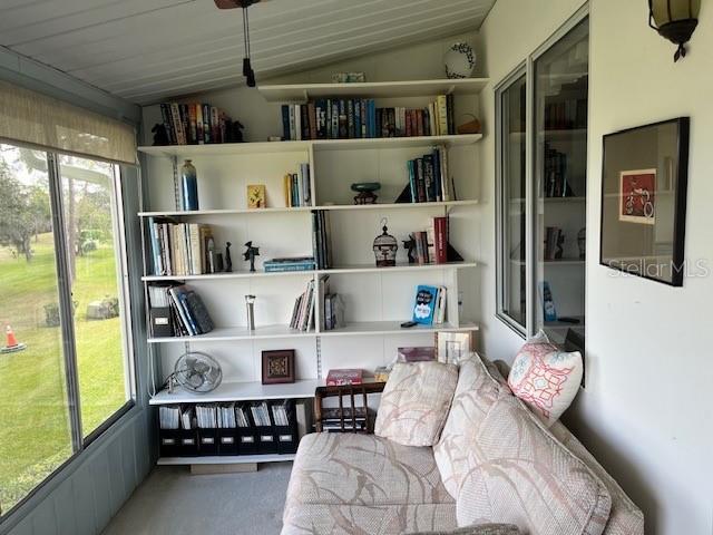 sitting room featuring lofted ceiling