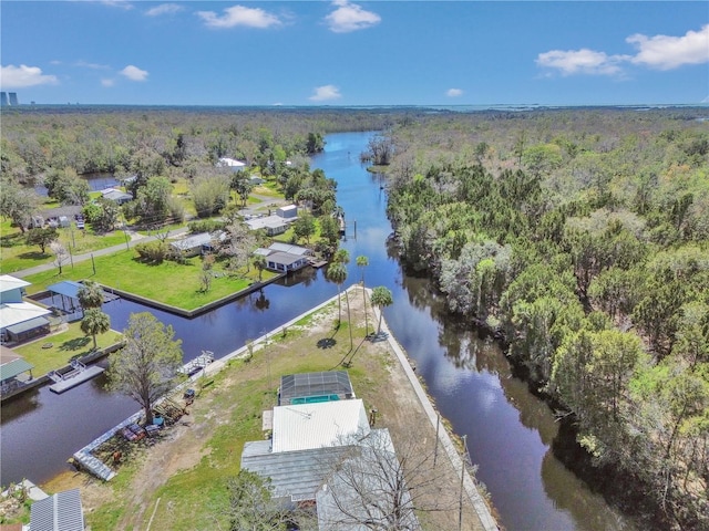 aerial view featuring a view of trees and a water view