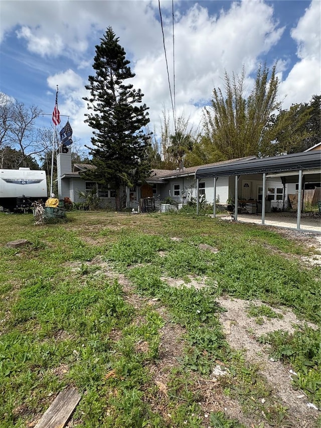 view of yard with a carport