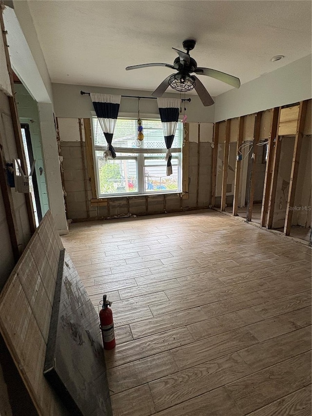 spare room featuring a ceiling fan and wood finished floors