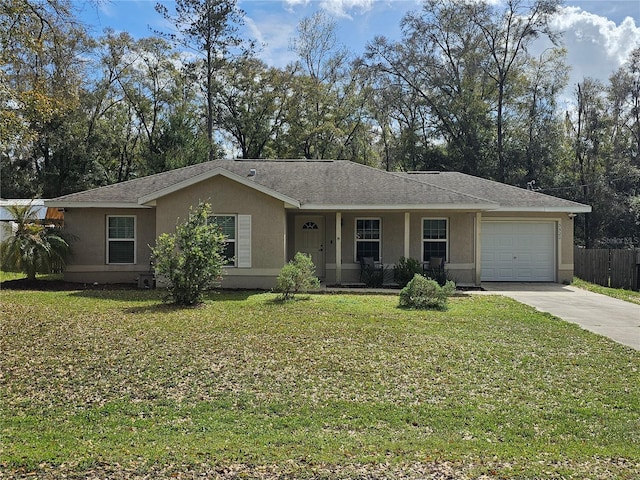 ranch-style house featuring a front yard, concrete driveway, fence, and stucco siding