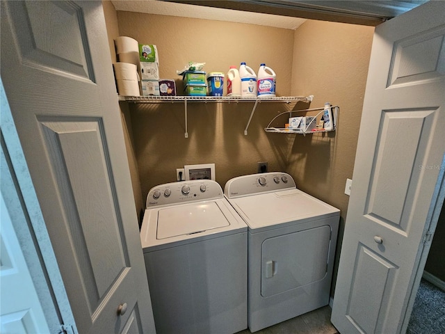 clothes washing area with laundry area and washer and dryer