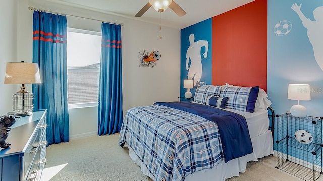 bedroom featuring a ceiling fan and light colored carpet