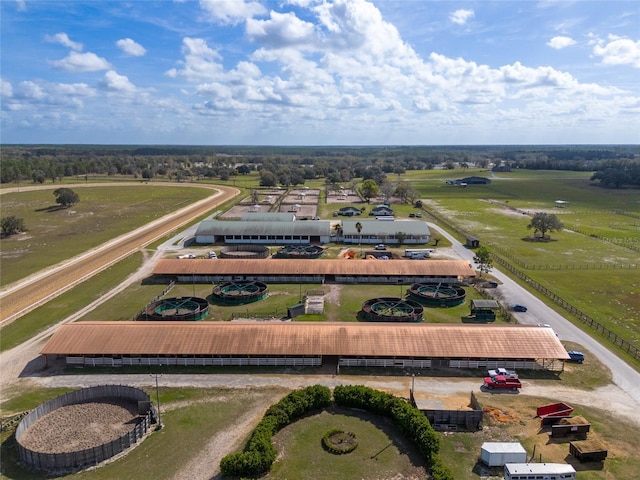 birds eye view of property featuring a rural view