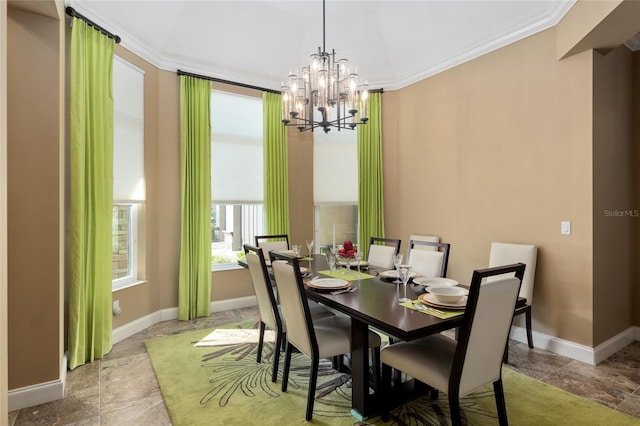 dining space featuring baseboards, stone finish flooring, and crown molding